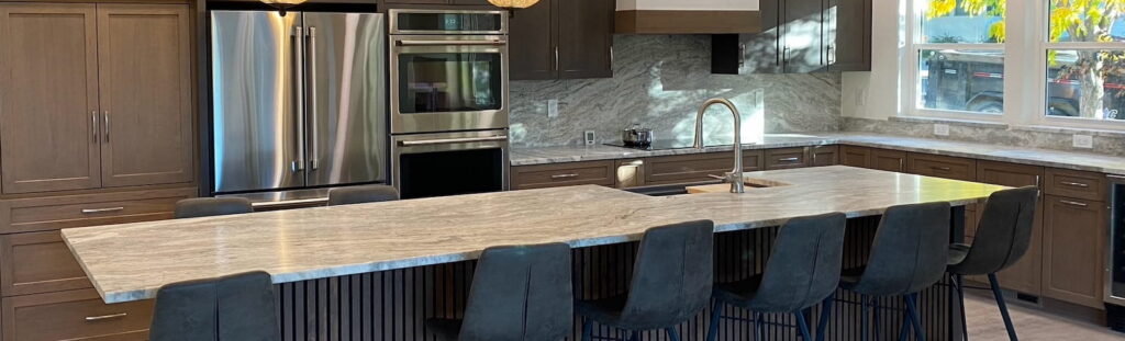 Gray marble kitchen counter, island, and backsplash